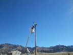 Volunteers installing Weather Station at Hydro Plant - 